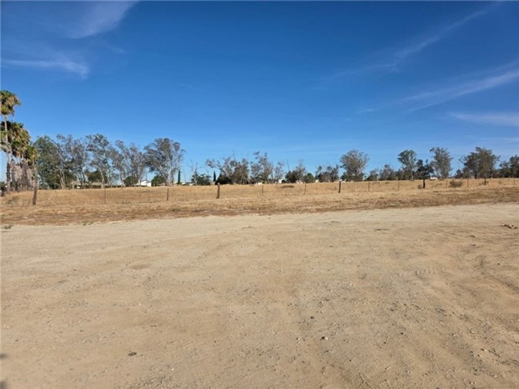 Open corner-lot land view from the Banning listing gallery